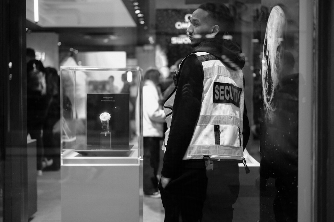 store detective watching customers
